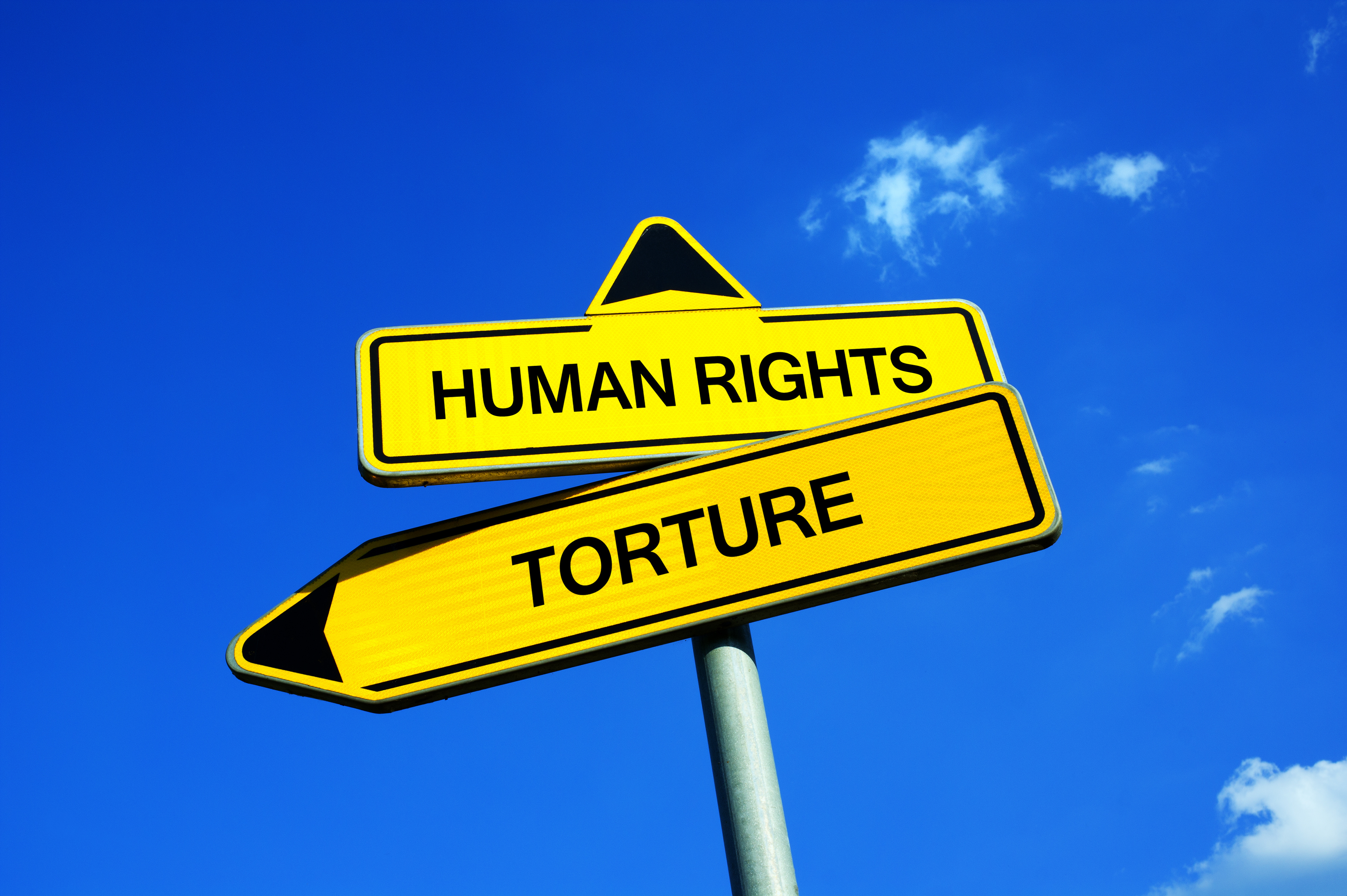Human Rights or Torture - Traffic sign with two options - prohibition of inhuman degrading and treatment vs using brutal and cruel method during interrogation, questioning as method of prevention